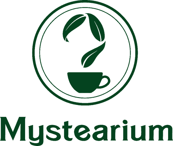 Mystearium logo featuring a dark green tea cup with three tea leaves floating above it, enclosed in a circular border, with the brand name ‘Mystearium’ written below in bold green lettering.